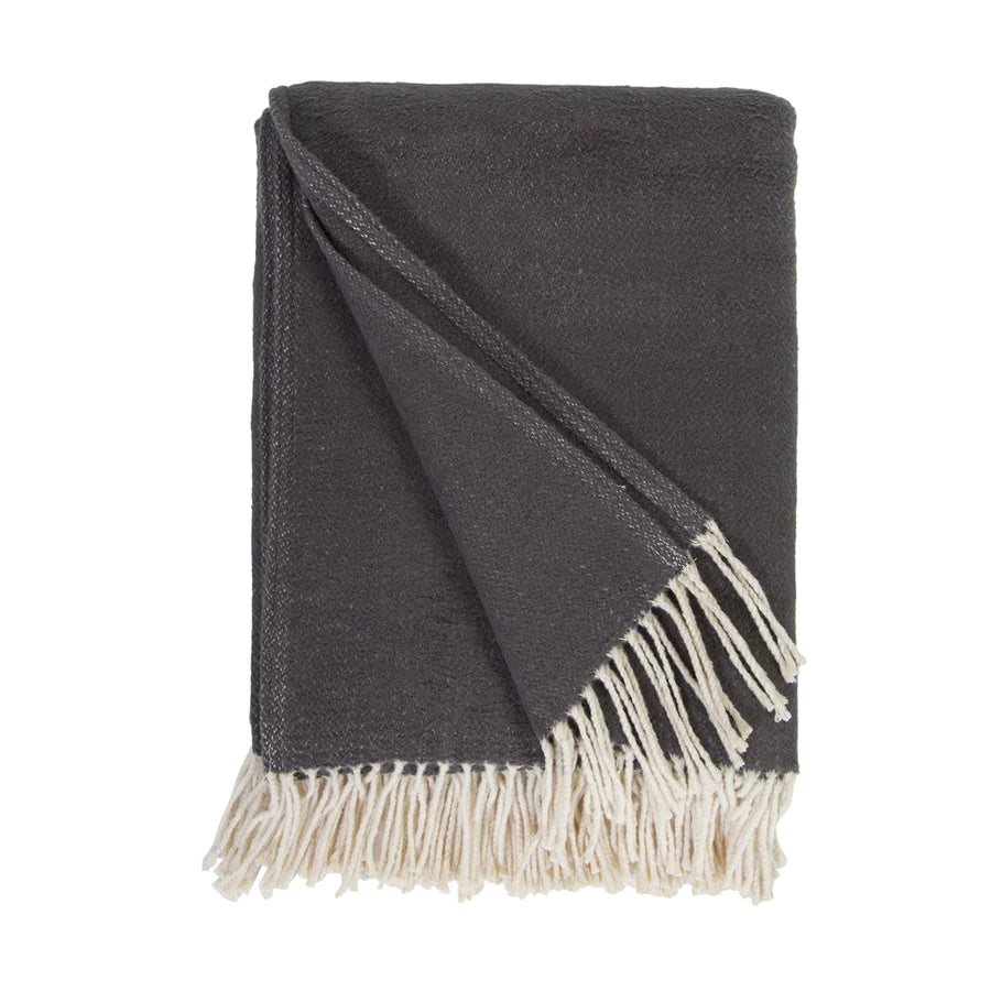 Cozy combed cotton Billie Charcoal Throw with a soft ivory interwoven weave ending in tassels.  Amethyst Home provides interior design services, furniture, rugs, and lighting in the Salt Lake City metro area.