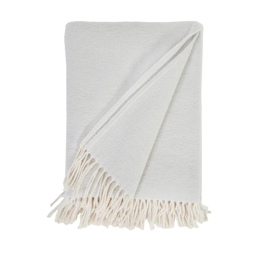 Cozy combed cotton Billie Light Grey Throw with a soft ivory interwoven weave ending in tassels.  Amethyst Home provides interior design services, furniture, rugs, and lighting in the Kansas City metro area.