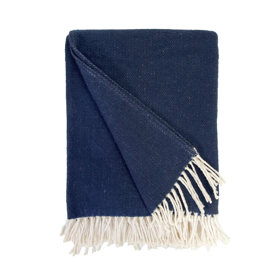 Cozy combed cotton Billie Navy Throw with a soft ivory interwoven weave ending in tassels.  Amethyst Home provides interior design services, furniture, rugs, and lighting in the Des Moines metro area.