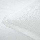 The Harbour White Matelasse Sham features an abstract, geometric weave making it a modern matelasse. The matelasse achieves a beautiful texture without any batting. Amethyst Home provides interior design services, furniture, rugs, and lighting in the Omaha metro area.