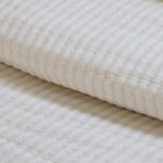 Add textural interest to your bed with the Vancouver Coverlet collection. Made of a lightweight stonewashed cotton gauze with an interwoven ivory stripe, it is the perfect addition to your bed to create a relaxing space. Amethyst Home provides interior design, new construction, custom furniture, and area rugs in the Laguna Beach metro area.