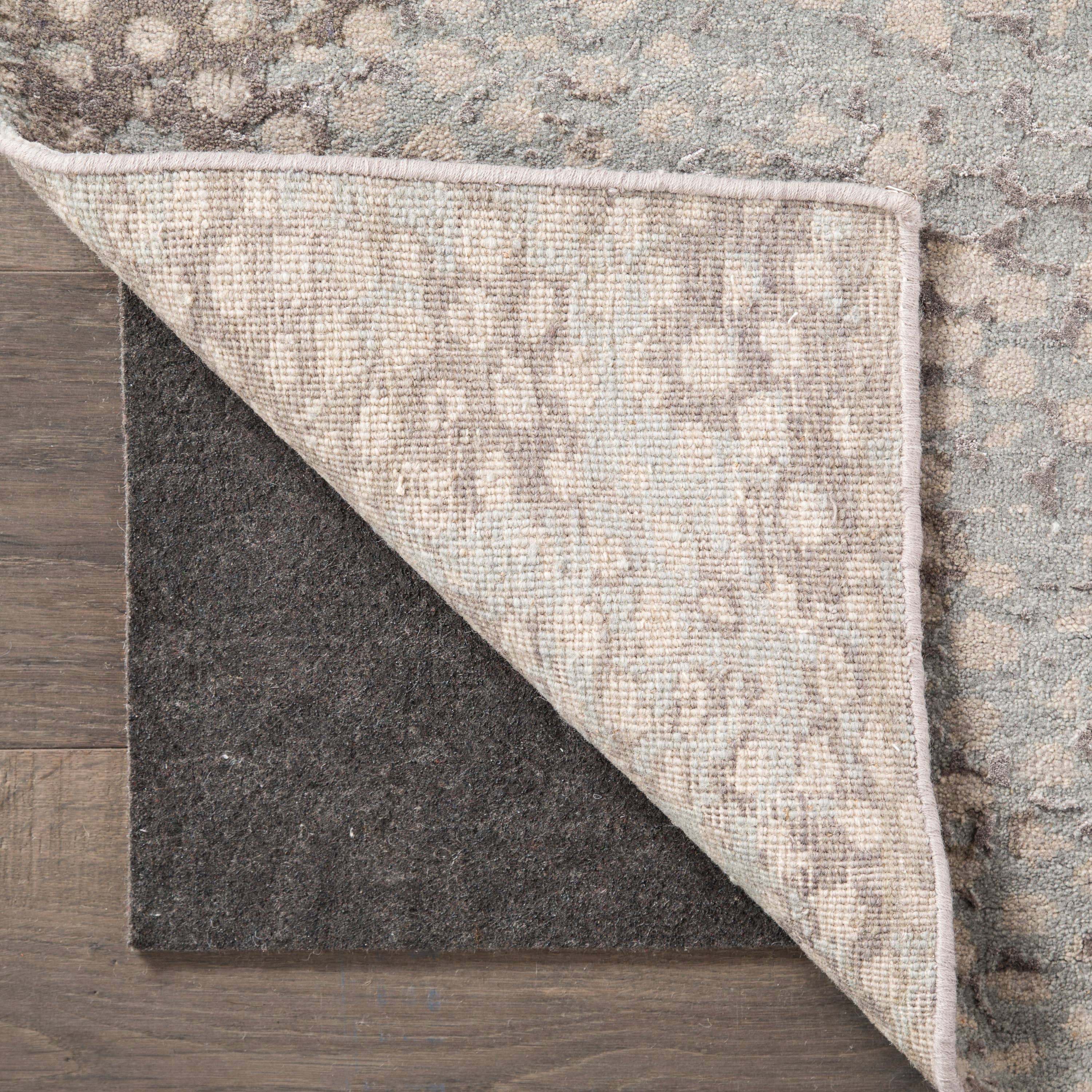 Perfect for any rug in the home, the Jaipur Living Premium Hold rug pad provides cushioning and insulation. With its needle-punched recycled fibers and textured rubber-backing, this floor covering ensures non-slip and durable protection that works for both hard surfaces and carpeted areas.   RP01  Handwash