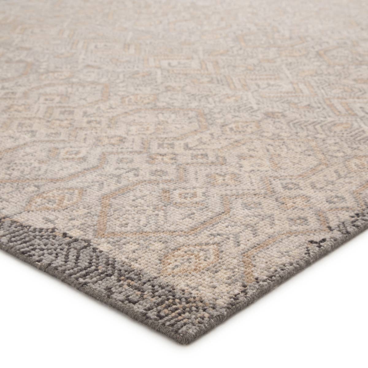 The Revolution collection is inspired by traditional style and beautifully detailed antique textile designs. The hand-knotted Prospect area rug showcases a captivating geometric design in muted tones of gray and gold. A charcoal edge creates a unique border effect around this globally inspired wool rug.  Hand-Knotted 100% Wool REL10
