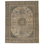 The Rhapsody Delpha Area Rug by Jaipur Living, or RHA05, boasts a beautiful medallion motif with a tile-like, decorative border detail. The light ivory tone is accented with rich green-blue, ochre, and sky blue hues. This durable wool hand knotted rug is perfect for the living room or other high traffic areas. 