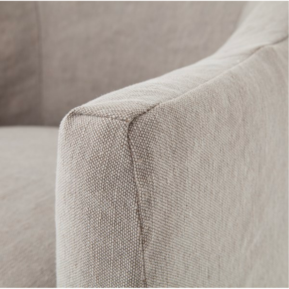 The traditional barrel chair gets a stylish, feminine update. Cunning curves covered in heather twill add eye-catching style and back-hugging support.  Size: 25.5" w x 25.25" d x 32.25" h Seat Depth: 19" Seat Height: 19.5" Arm Height from Floor: 24.5" Arm Height from Seat: 5"  Colors: Heather Twill Stone Materials: 50% Cotton/50% Jute