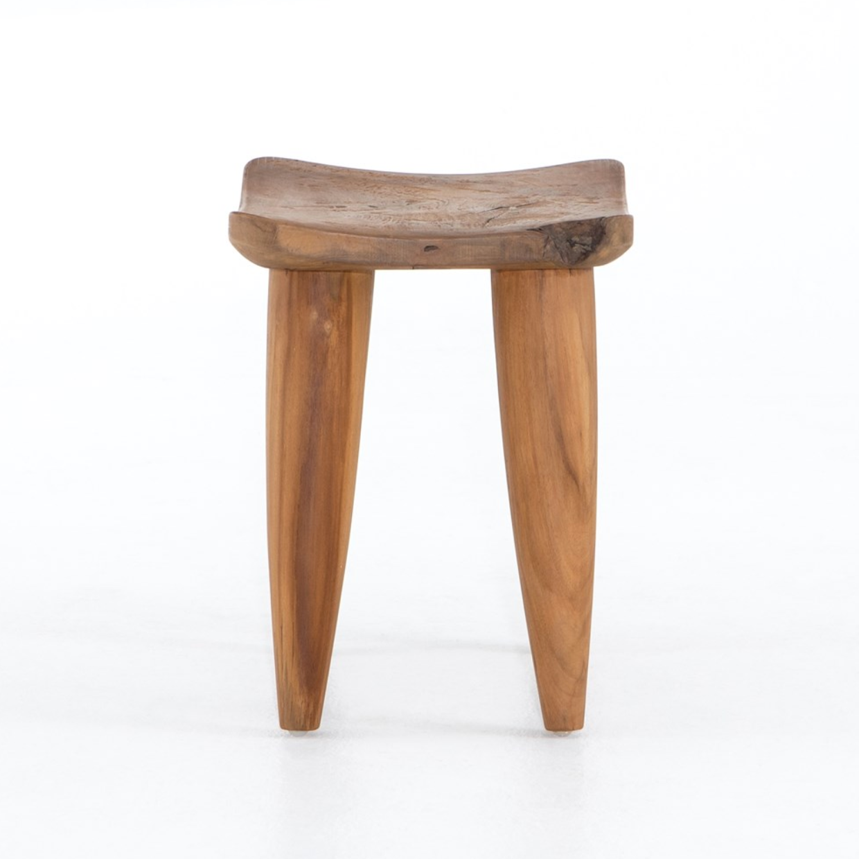 Featuring Zuri Outdoor Stool - Aged Natural Teak by Four Hands at Amethyst Home. Inspired by West African design, natural teak features organic knots, holes and graining to reflect its materials' rich roots, indoors or out. Cover or store inside during inclement weather and when not in use.
Overall Dimensions: 20"W x 13"L x 17"HColors: Aged Natural TeakMateria.  Amethyst Home provides interior design, new home construction design consulting, vintage area rugs, and lighting in the Tampa metro area.