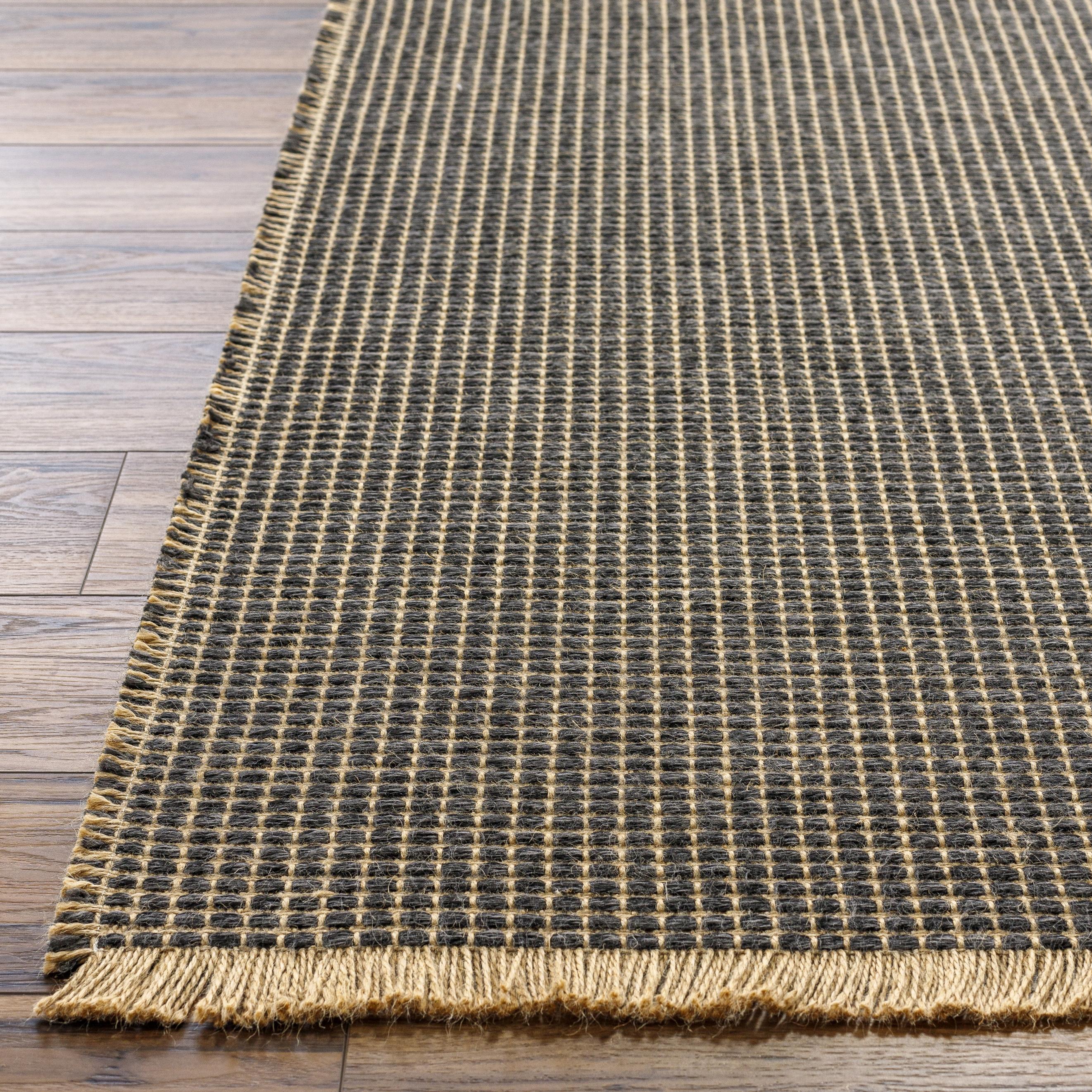 This beautiful Kimi area rug is the perfect addition to any room in your home. The special collaboration between Surya and Becki Owens has created a unique, eye-catching design that will bring texture and style to your space. The rug is made from polypropylene and jute, creating a textural woven pattern in natural tones with dark contrast. Amethyst Home provides interior design, new home construction design consulting, vintage area rugs, and lighting in the Miami metro area.