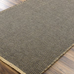 This beautiful Kimi area rug is the perfect addition to any room in your home. The special collaboration between Surya and Becki Owens has created a unique, eye-catching design that will bring texture and style to your space. The rug is made from polypropylene and jute, creating a textural woven pattern in natural tones with dark contrast. Amethyst Home provides interior design, new home construction design consulting, vintage area rugs, and lighting in the Tampa metro area.