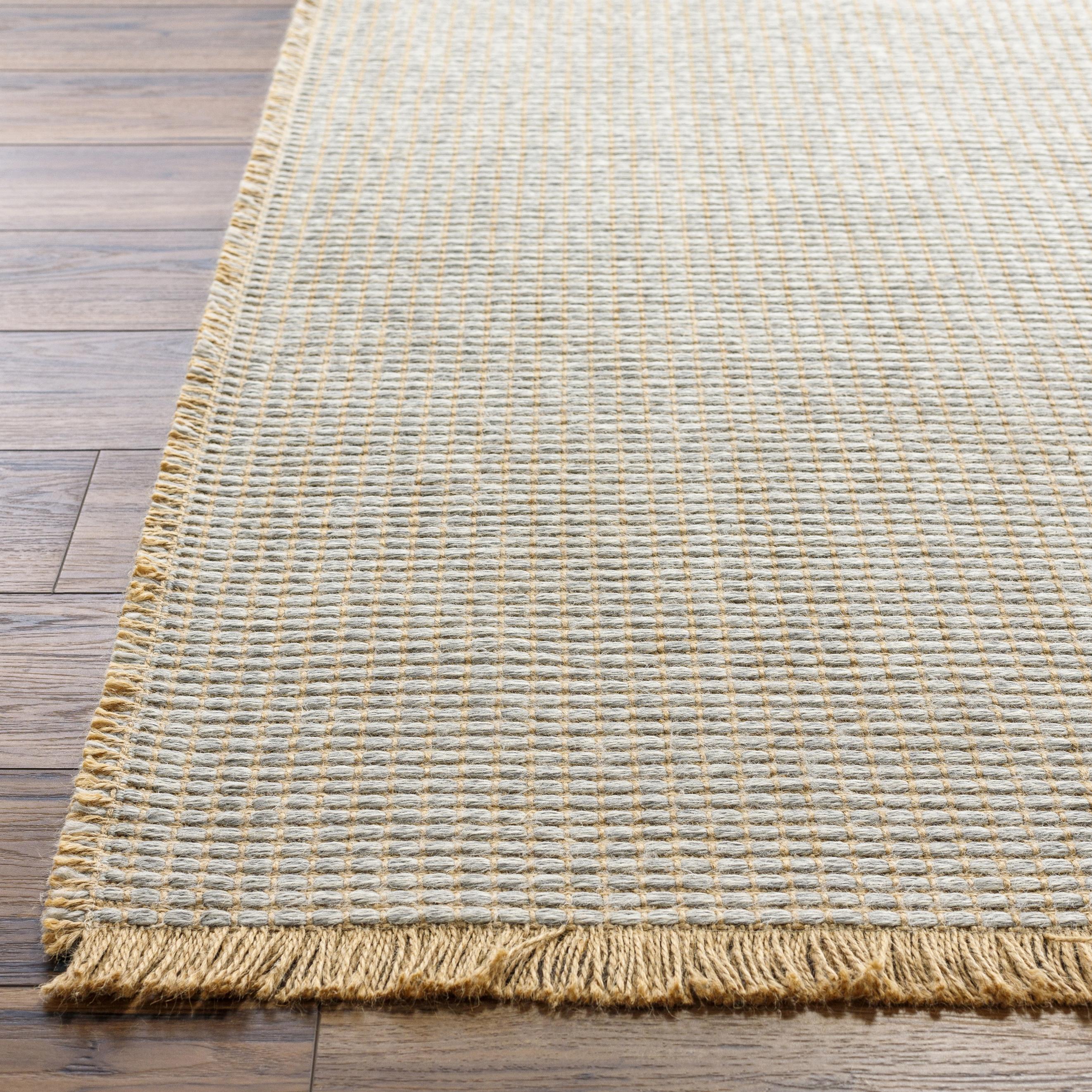 Introducing the Kimi area rug! This stunning and unique piece of art was designed in collaboration between Surya and Becki Owens, two creative minds coming together to create something special. The Kimi rug features a beautiful stitched design, with a textural woven pattern and self tassels that make it a one-of-a-kind addition to any space. Amethyst Home provides interior design, new home construction design consulting, vintage area rugs, and lighting in the Winter Garden metro area.