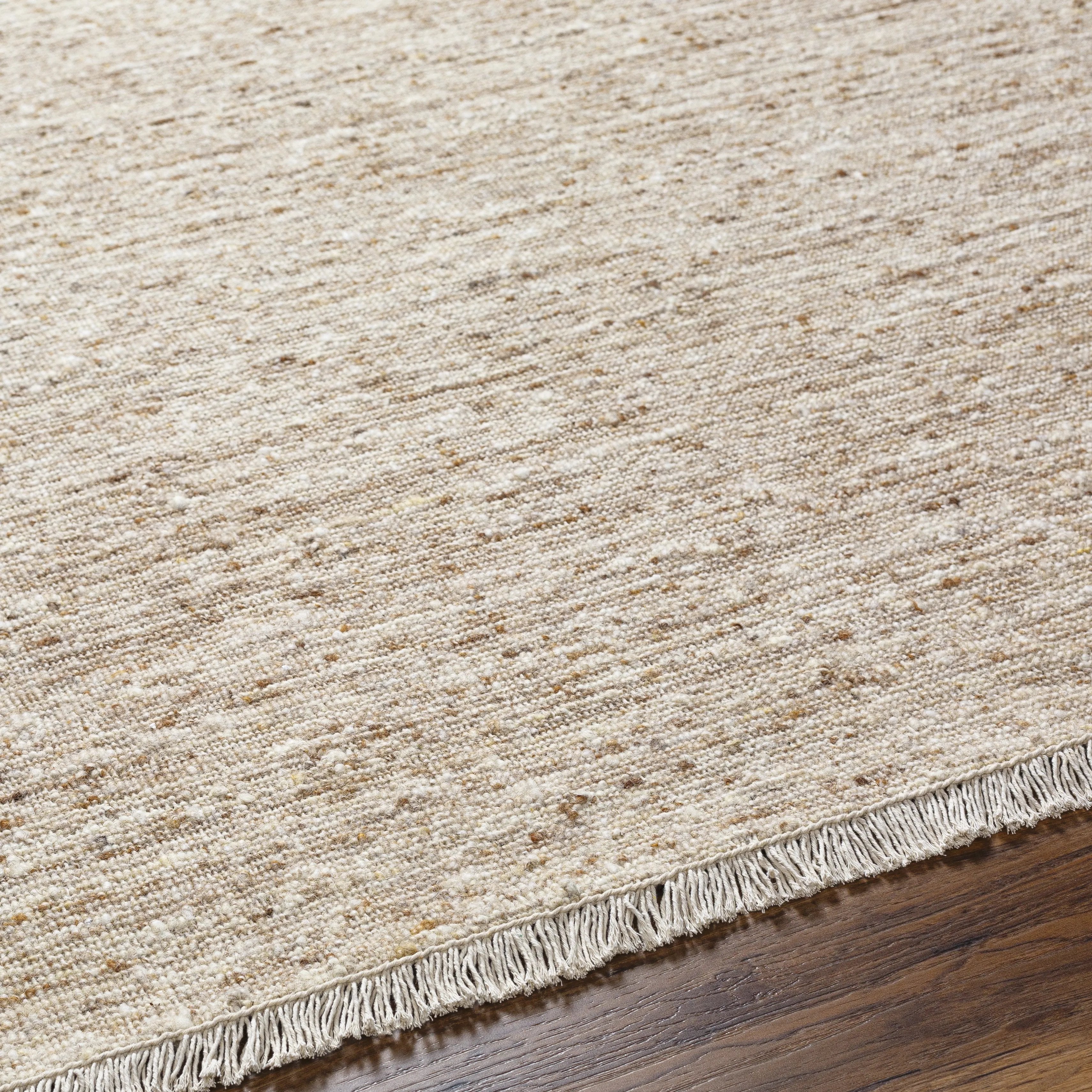 A modern, heathered warm beige look.  This is a great rug if you have other dominant design features in a space like a striking fireplace or standout patterns Amethyst Home provides interior design, new home construction design consulting, vintage area rugs, and lighting in the Kansas City metro area.