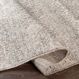 The Tunus Silver Rug features a globally inspired design made from wool. The hand-knotted rug adds wabi sabi charm to any room. Amethyst Home provides interior design, new home construction design consulting, vintage area rugs, and lighting in the Boston metro area.