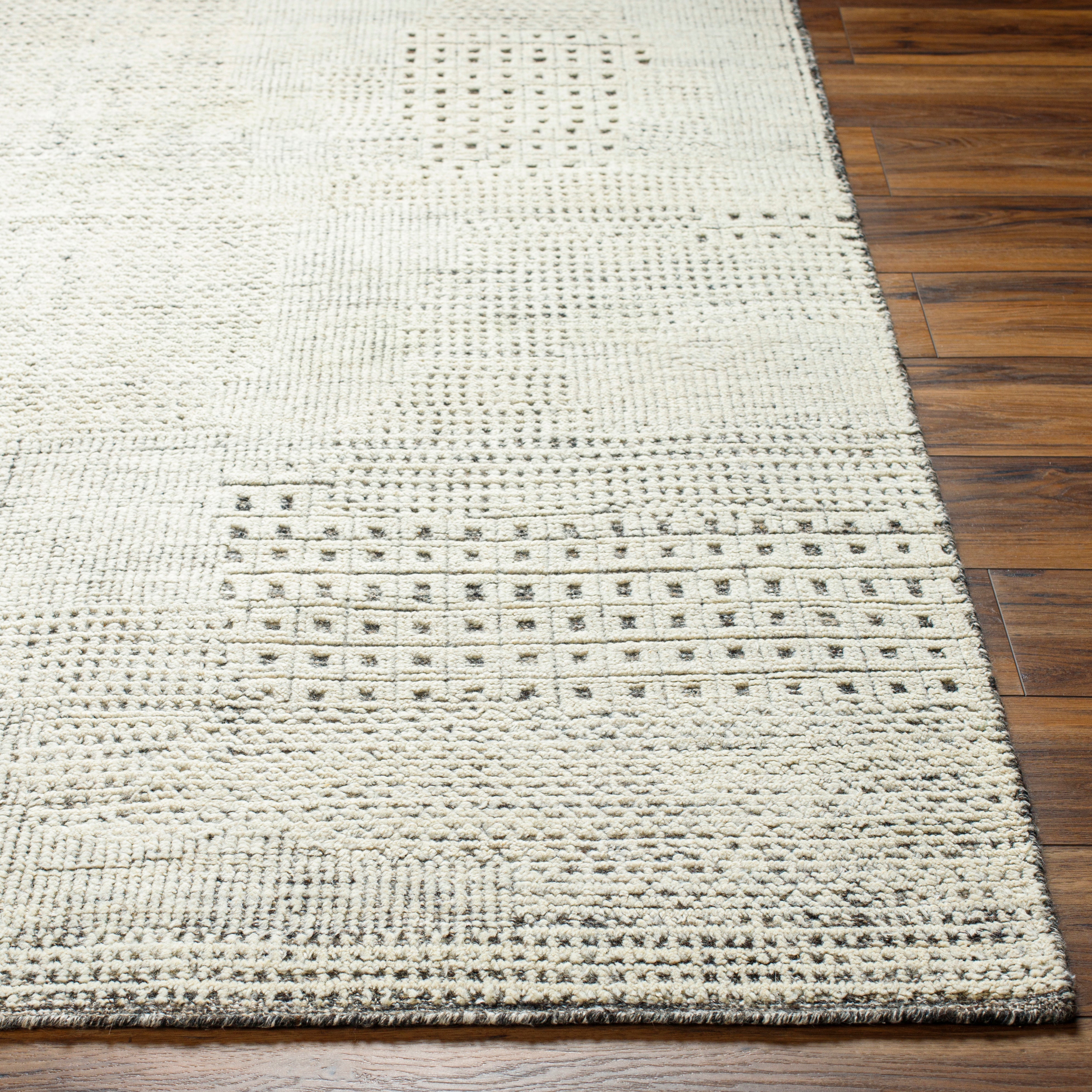 The Tunus Taupe Rug features a globally inspired design made from wool. The hand-knotted rug adds wabi sabi charm to any room. Amethyst Home provides interior design, new home construction design consulting, vintage area rugs, and lighting in the Alpharetta metro area.