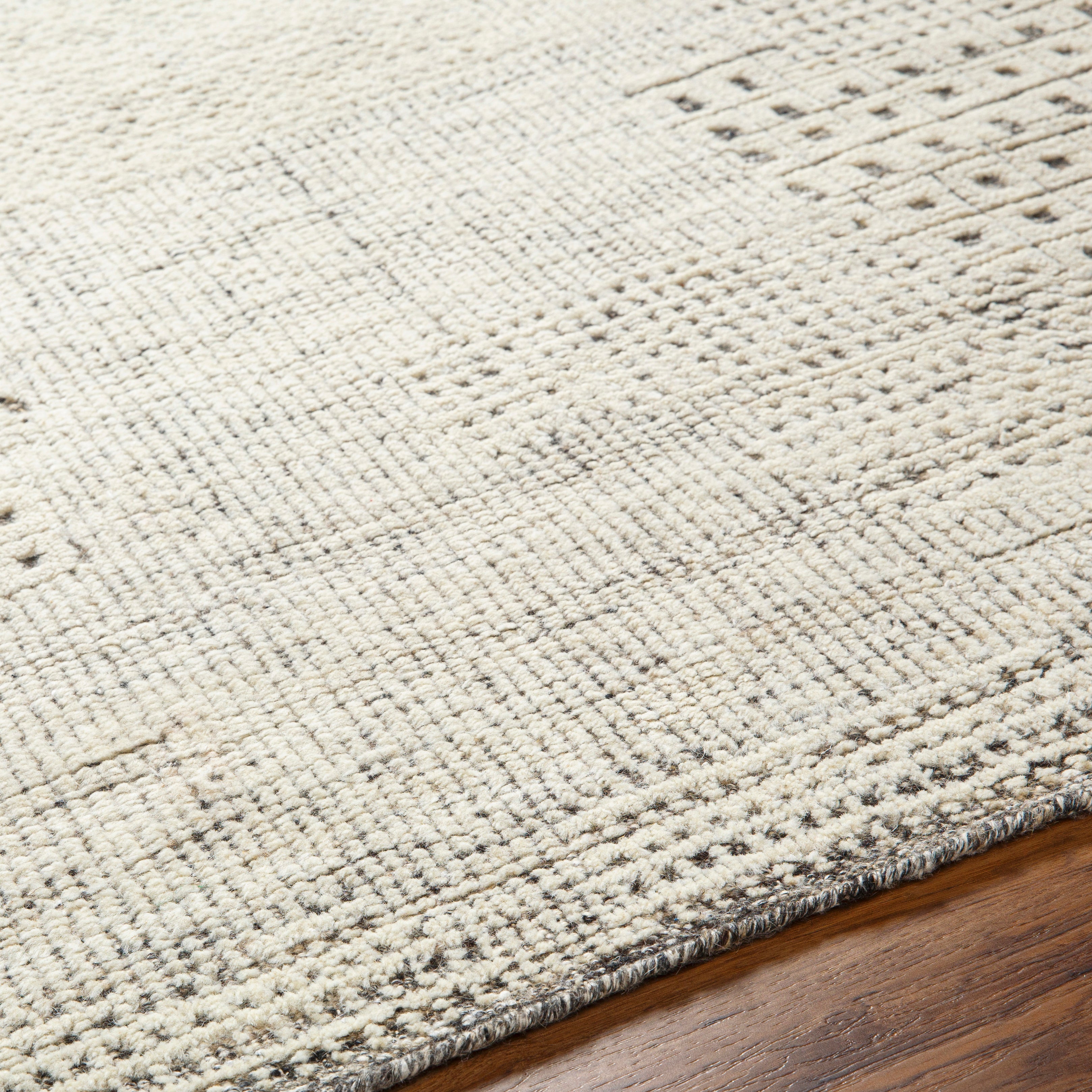The Tunus Taupe Rug features a globally inspired design made from wool. The hand-knotted rug adds wabi sabi charm to any room. Amethyst Home provides interior design, new home construction design consulting, vintage area rugs, and lighting in the Kansas City metro area.