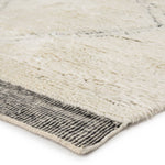The Tala collection of hand-knotted rugs brings a new sense of luxury and comfort to the contemporary home. The Ephesus rug makes a modern Moroccan statement, showcasing an asymmetrical geometric motif and a striped flatweave border. An ultra-plush pile of soft wool highlights the unique design of this ivory and black accent.  Hand-Knotted 100% Wool TAL06