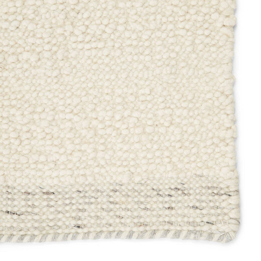 The Vestra Alondra Rug by Jaipur Living, or VST01, is hand-loomed and blended of durable wool and polyester. The light and bright Alondra rug features a textural, ivory design trimmed with flatwoven gray and ivory heathered edges. A perfect choice for your bedroom, living room, or other medium traffic area. 