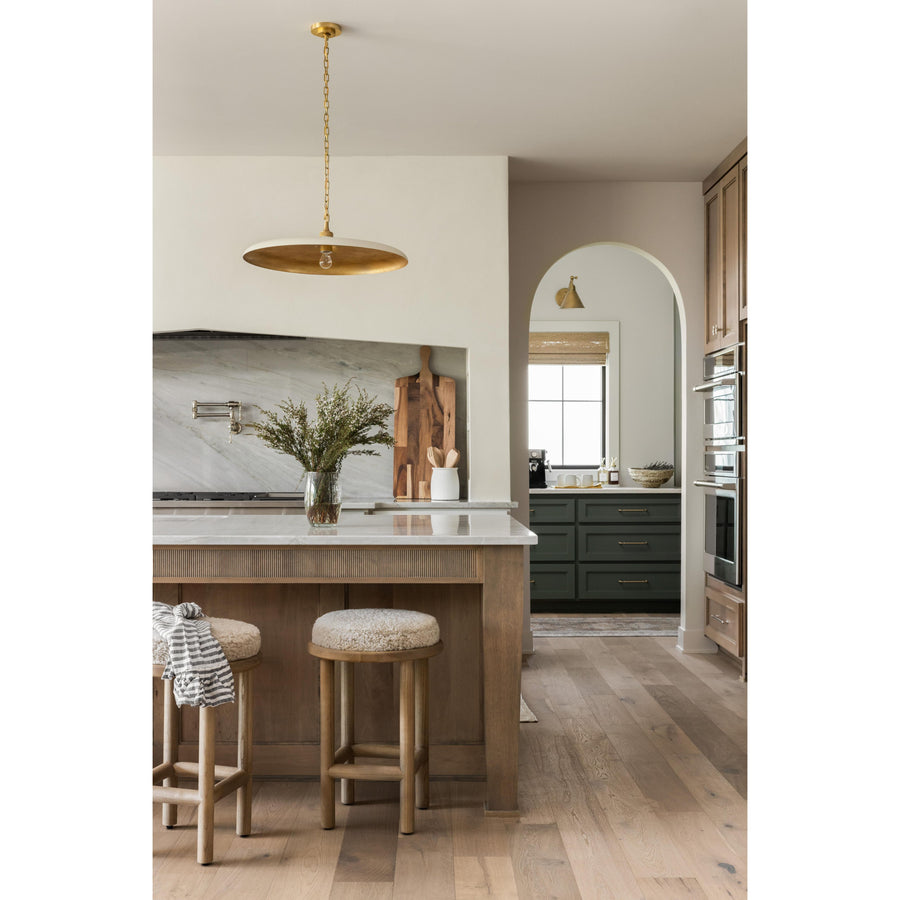 Introducing the Piatto Large Pendant, the perfect lighting piece for your kitchen island. Pair it with reeded cabinet detail, quartzite slab kitchen backsplash, quartzite kitchen counters, quarter sawn white oak cabinets, arched kitchen cabinets, and a plaster range hood for a cohesive look. Inspired by the Chris Loves Julia kitchen style, this pendant light is a must-have for any modern coastal-inspired home design in Nashville, Florida, or Utah.