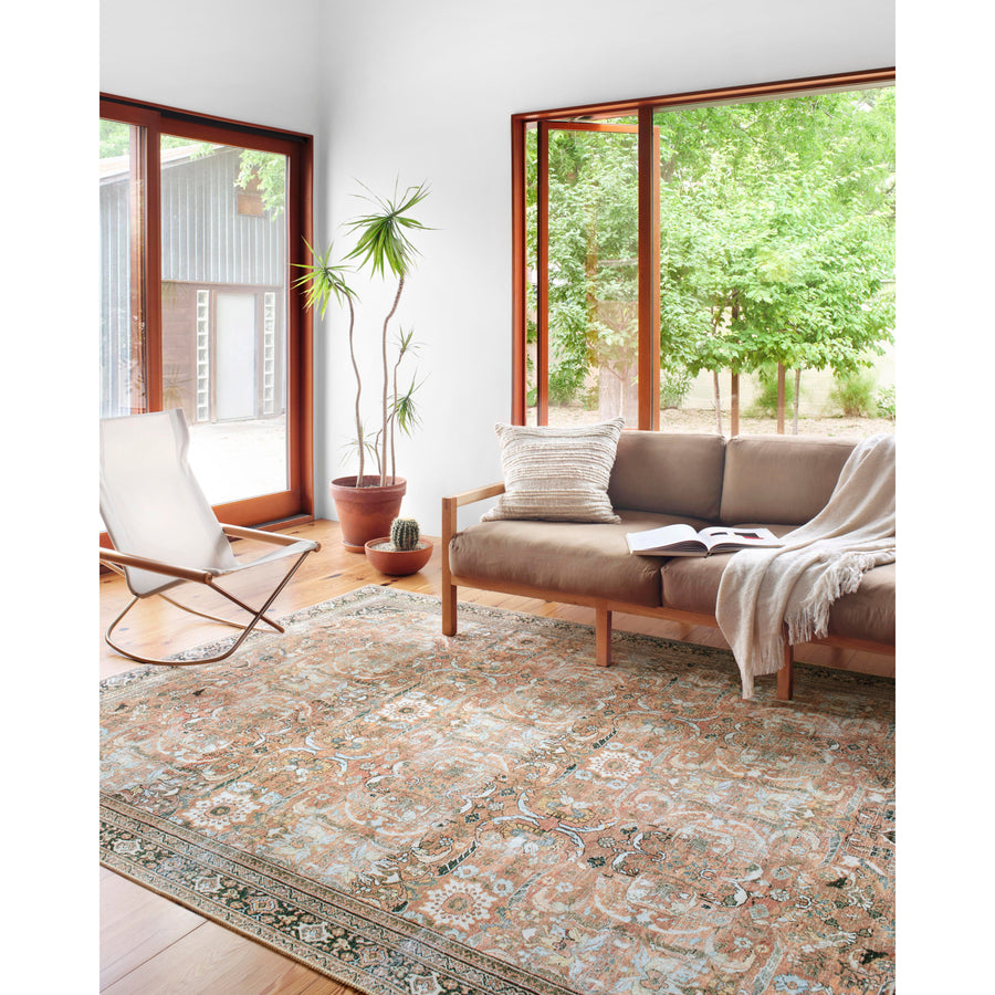 The Wynter Auburn / Multi area rug showcases a one-of-a-kind vintage or antique area rug look power-loomed of 100% polyester. This rug brings in tones of orange, brown, black, and hints of blue. The rug is ideal for high traffic areas such as living rooms, dining rooms, kitchens, hallways, and entryways.
