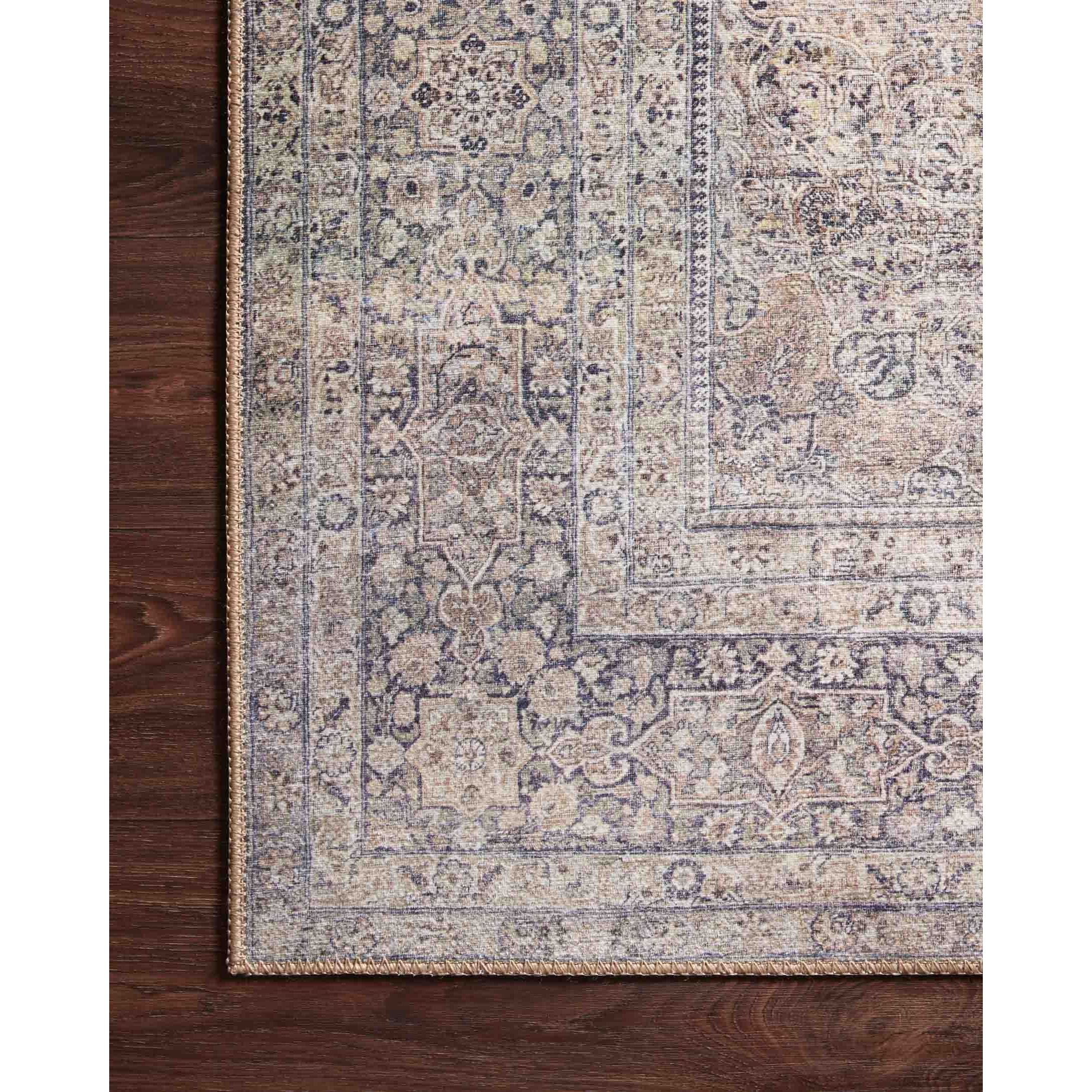 The Wynter Silver / Charcoal area rug showcases a one-of-a-kind vintage or antique area rug look power-loomed of 100% polyester. This rug brings in tones of silver, gray, blue, tan, and hints of green. The rug is ideal for high traffic areas such as living rooms, dining rooms, kitchens, hallway, and entryways.