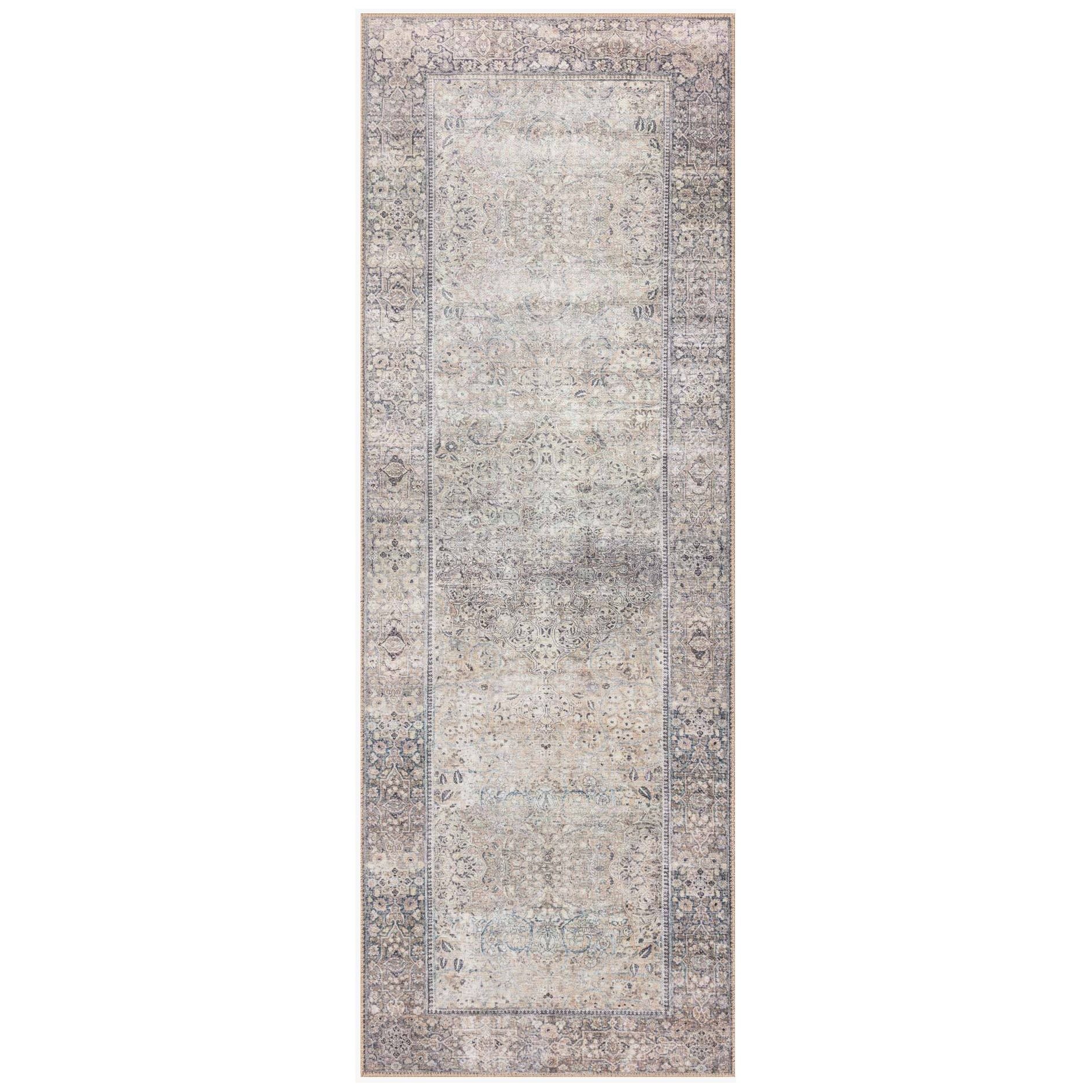 The Wynter Silver / Charcoal area rug showcases a one-of-a-kind vintage or antique area rug look power-loomed of 100% polyester. This rug brings in tones of silver, gray, blue, tan, and hints of green. The rug is ideal for high traffic areas such as living rooms, dining rooms, kitchens, hallway, and entryways.