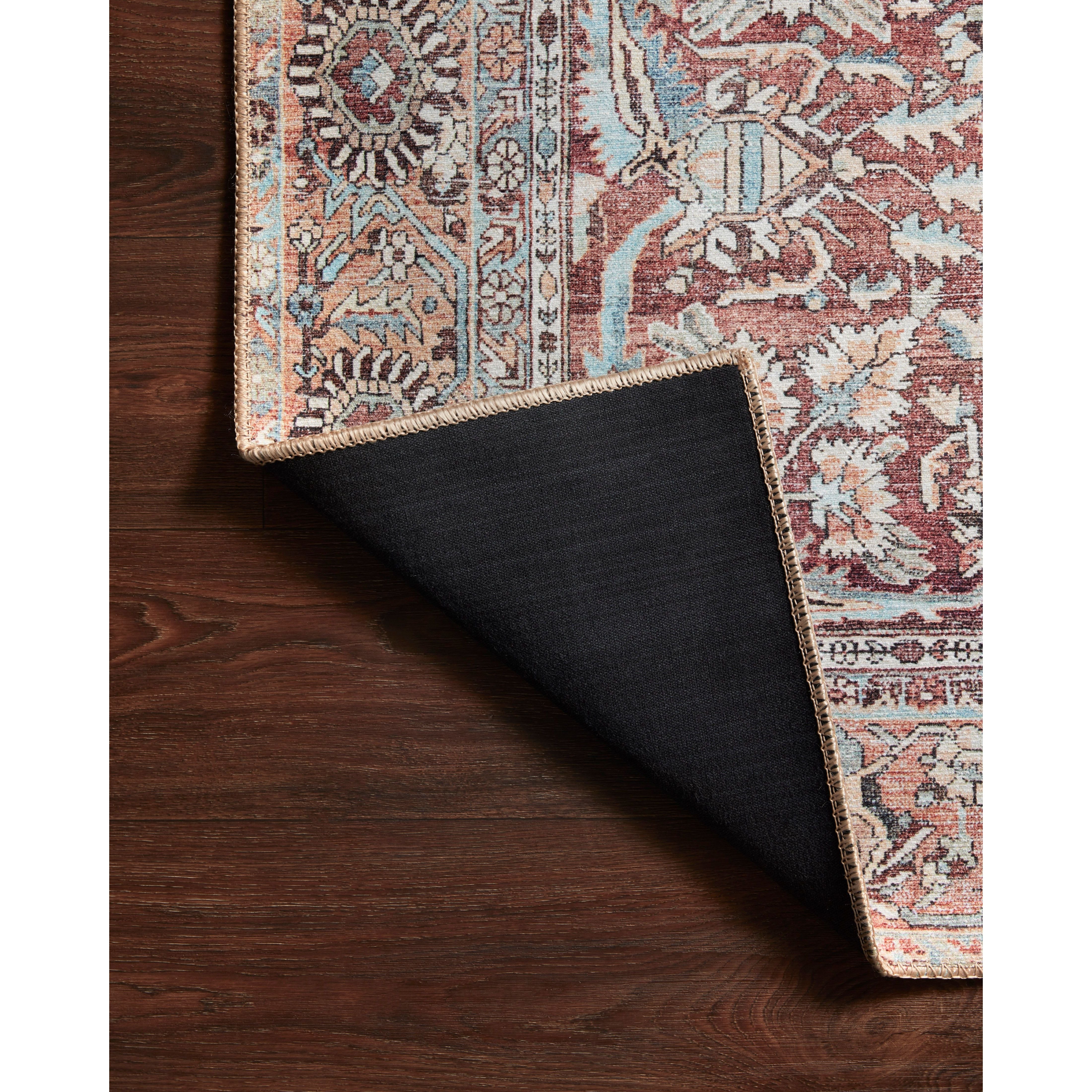 The Wynter Tomato / Teal area rug showcases a one-of-a-kind vintage or antique area rug look power-loomed of 100% polyester. This rug brings in tones of red, orange, blue, and ivory. The rug is ideal for high traffic areas due to the rug's durability for living rooms, dining rooms, kitchens, hallways, and entryways.