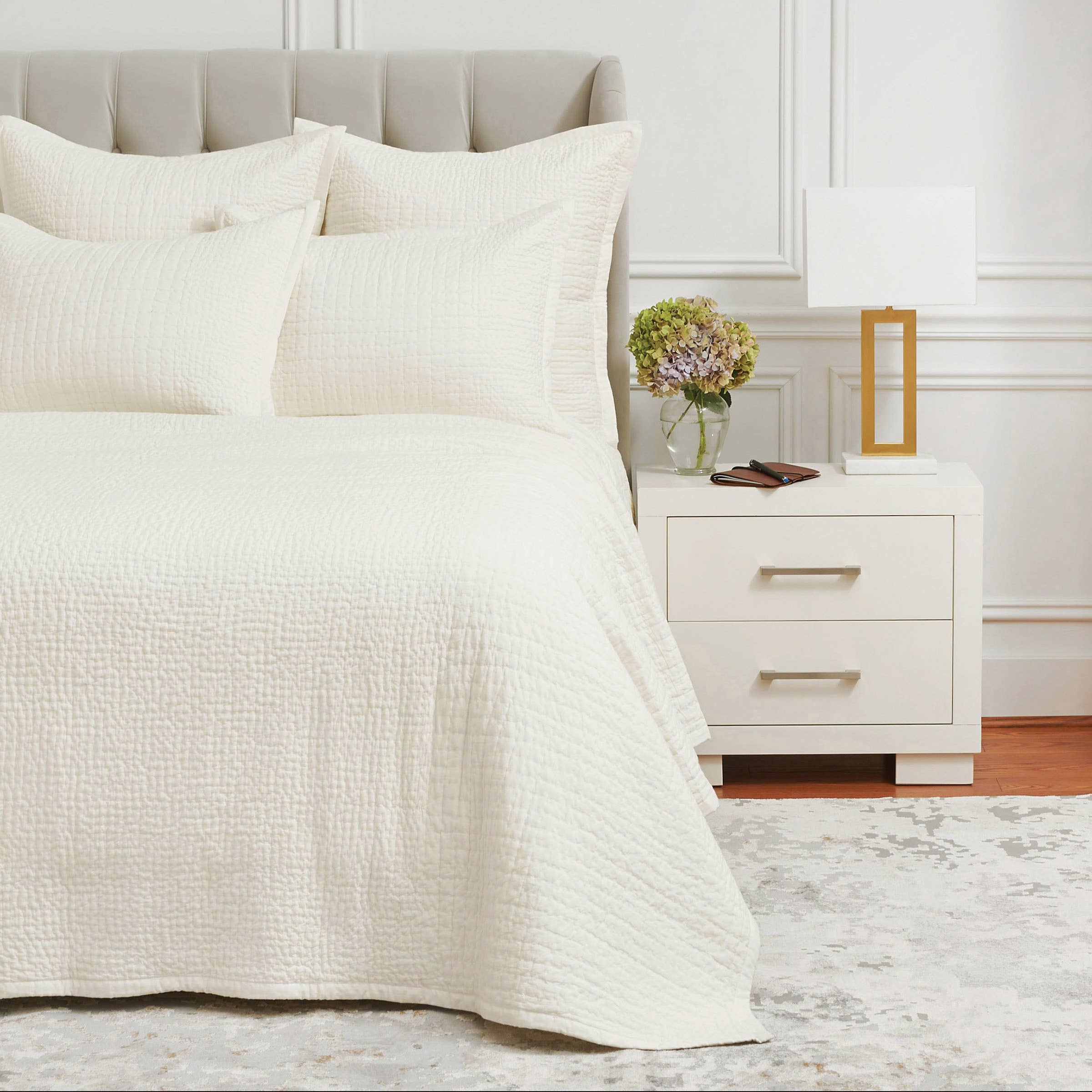 The Willa Ivory sham features two complementary quilting styles, both hand-stitched by skilled artisans for a uniquely luxurious experience. This lightweight 100% cotton voile collection is the perfect neutral backdrop upon which to build a personal retreat. Amethyst Home provides interior design services, furniture, rugs, and lighting in the Malibu metro area.