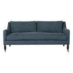 The Yvonne Upholstered Sofa by Cisco Brothers features curved arms and clean lines. The mid-century feel brings the whole family together in a comfortable, attractive seating. Photographed in Navedo Gravel and Rye Midnight Blue.      Overall: 72"w x 36"d x 31"h