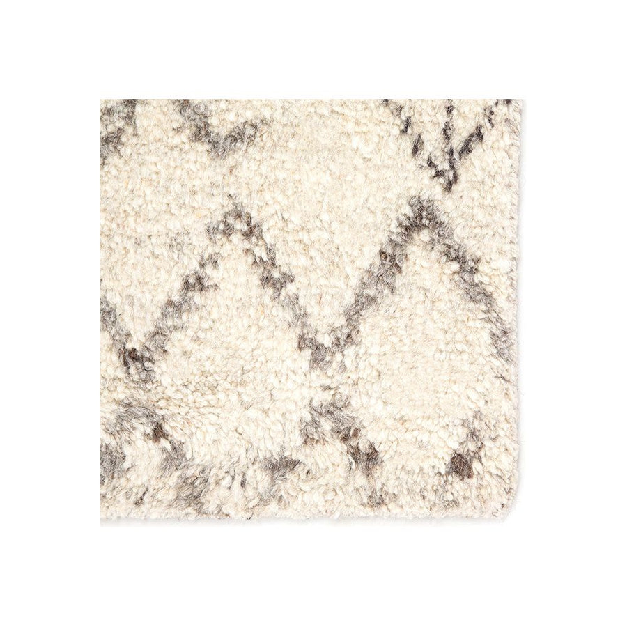 Soft and luxurious in feel, the Zuri Turtledove/Walnut area rug by Jaipur Living is a modern take on a classic Moroccan area rug. The Zuri is made from supple hand-knotted, 100% wool in natural tones of ivory and brown. This rug would be perfect for a living room, bedroom, or hallway in the runner size.