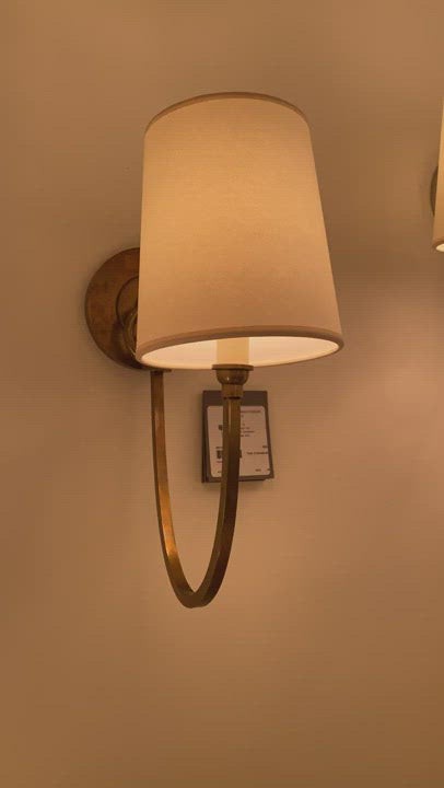The Reed Single Sconce has a natural paper shade that brings exudes warmth. This would look gorgeous in a hallway, bathroom, or another area needing extra light.  Designer: Thomas O'Brien