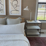 We love the hand-rubbed antique brass matched with either plaster white or black in this Charlton Table Lamp. This is the perfect lamp for your office, bedroom, or other space needing controlled light.   Designer: AERIN