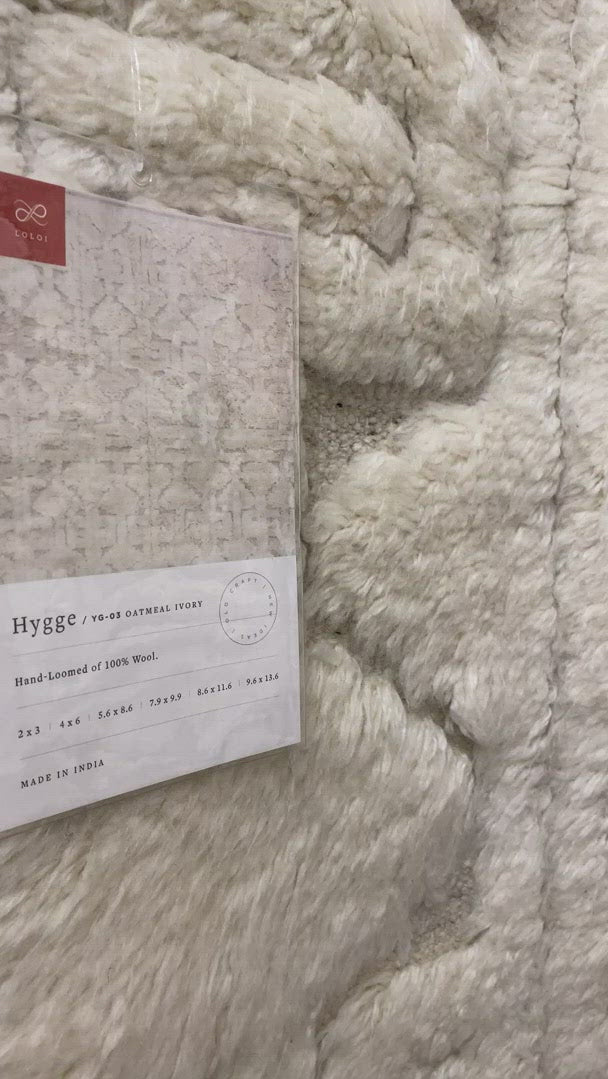 Inspired by Scandinavian textile motifs, the Hygge Collection combines a soft shaggy texture with an enduring neutral palette. Each piece is hand-loomed in India of 100% wool, ensuring long-wearing durability in even the busiest of rooms.     Hand Loomed 100% Wool India YG-03 Oatmeal/Ivory