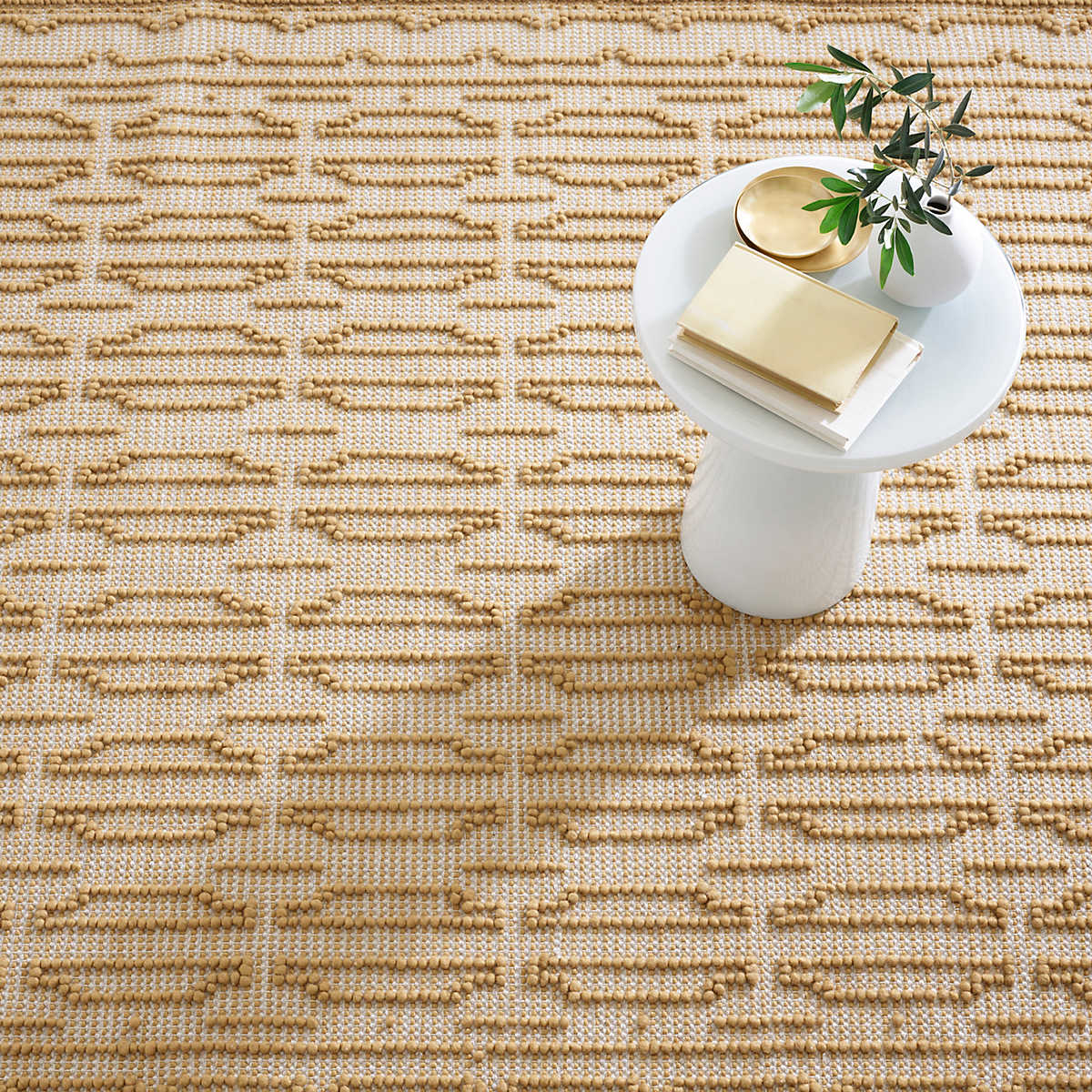 The Campbell Sand Rug relief pattern plays across a gently marled woven wool ground, accentuating the graphic dimension created by the different weaves. The central motif is repeated inversely to create a border around this sumptuous rug. Amethyst Home provides interior design services, furniture, rugs, and lighting in the Miami metro area.
