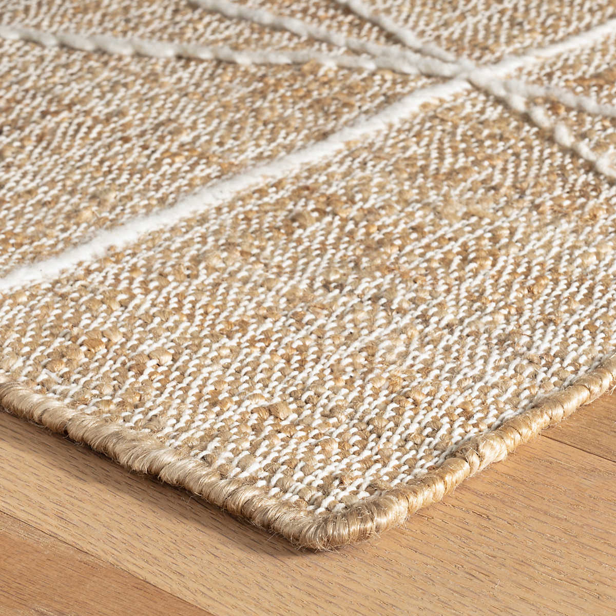 The Judson Natural/Ivory gorgeous flatwoven rug, hand-loomed from slubby, naturally colored jute makes a bold and sustainable statement that's punctuated with a random, large-scale geometry of cotton embroidery. Amethyst Home provides interior design services, furniture, rugs, and lighting in the Monterey metro area.