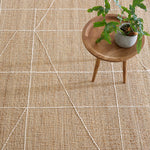 The Judson Natural/Ivory gorgeous flatwoven rug, hand-loomed from slubby, naturally colored jute makes a bold and sustainable statement that's punctuated with a random, large-scale geometry of cotton embroidery. Amethyst Home provides interior design services, furniture, rugs, and lighting in the Seattle metro area.