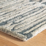 The Malone Everglade Rug is additionally emphasized by higher sheared tufts that contrast in color, sheen, and texture with dense and low looped stripes. A natural undyed fleece pile enhances the finely observed irregular striations. With modern and traditional elements, this sophisticated hand-knotted wool rug demonstrates unique textures found in nature. Amethyst Home provides interior design services, furniture, rugs, and lighting in the Kansas City metro area.