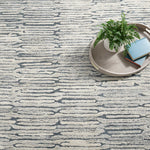 The Malone Everglade Rug is additionally emphasized by higher sheared tufts that contrast in color, sheen, and texture with dense and low looped stripes. A natural undyed fleece pile enhances the finely observed irregular striations. With modern and traditional elements, this sophisticated hand-knotted wool rug demonstrates unique textures found in nature. Amethyst Home provides interior design services, furniture, rugs, and lighting in the Miami metro area.