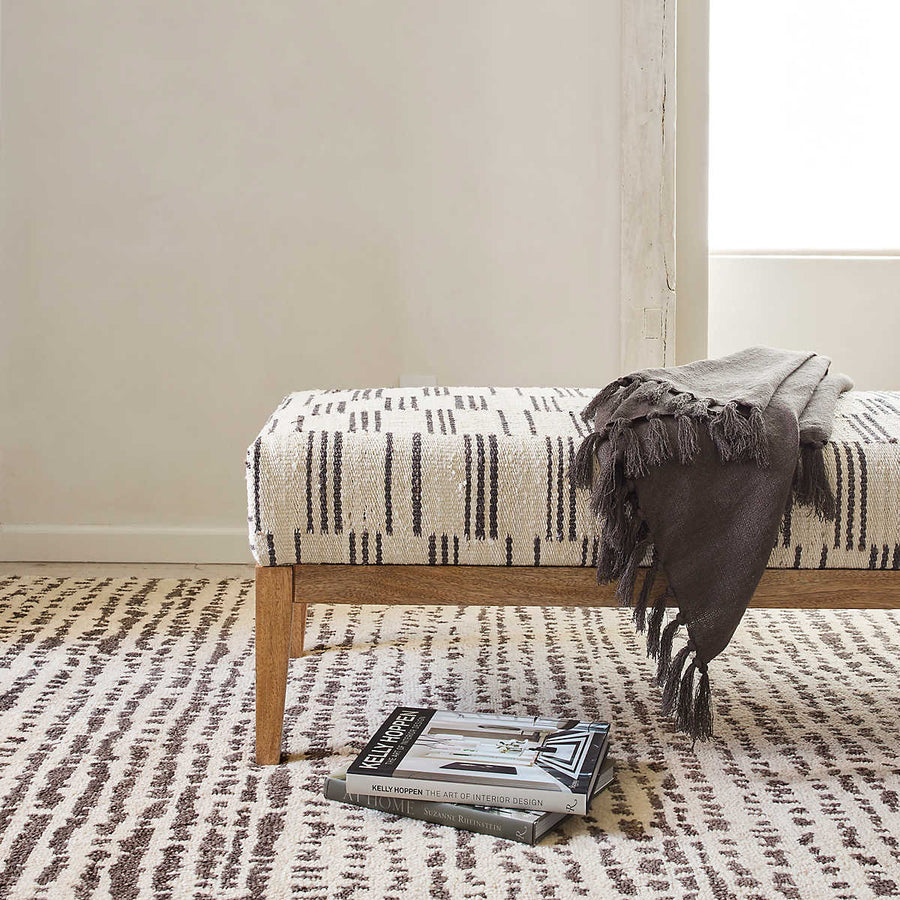 The Shepherd Pebble Rug deeply dense and cushy pile serves to highlight the beauty of the unbleached color variations of natural wool fleece. The random stippling of irregularly shaped splotches is a signature motif of Marie Flanigan, an award-winning interior designer. Amethyst Home provides interior design services, furniture, rugs, and lighting in the Seattle metro area.