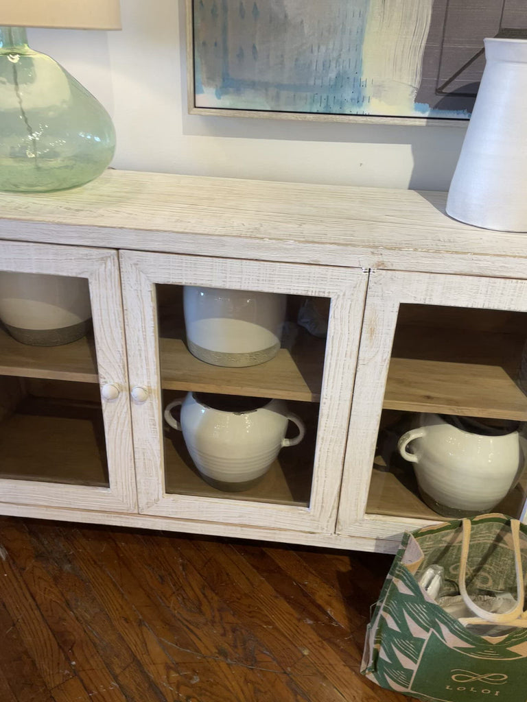 We love the rustic look the reclaimed pine and white wash finish brings to this Agno Sideboard. With six doors opening to shelves, this provided ultimate storage for all your family heirlooms, china, and other household items. 