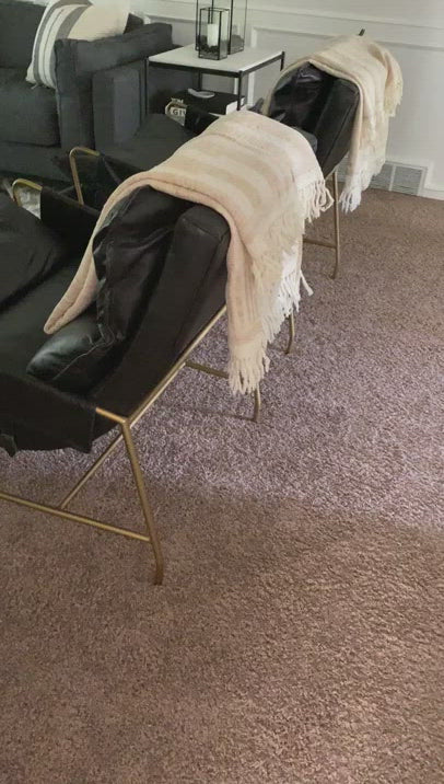 A nod to relaxed modernism, playing up the natural depth of exclusive top-grain leather, with buckle details and low-slung styling crafting the hippest of vibes.  Overall Dimensions: 28.00"w x 37.00"d x 35.00"h Seat Depth: 22" Seat Height: 20" Arm Height from Floor: 23.5" Arm Height from Seat: 3.5"