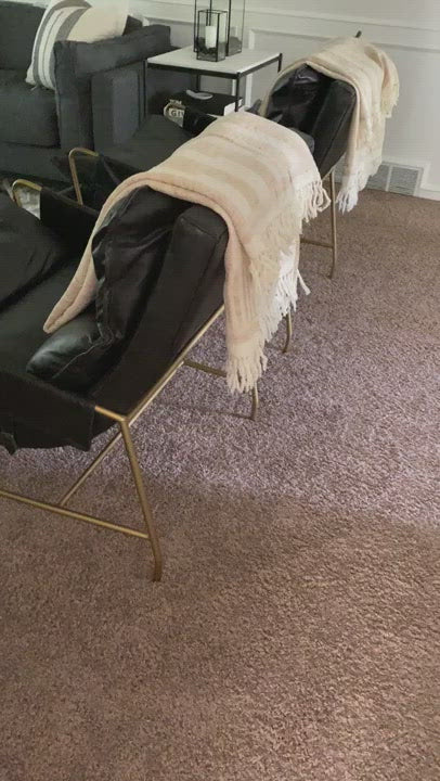 A nod to relaxed modernism, playing up the natural depth of exclusive top-grain leather, with buckle details and low-slung styling crafting the hippest of vibes.  Overall Dimensions: 28.00"w x 37.00"d x 35.00"h Seat Depth: 22" Seat Height: 20" Arm Height from Floor: 23.5" Arm Height from Seat: 3.5"