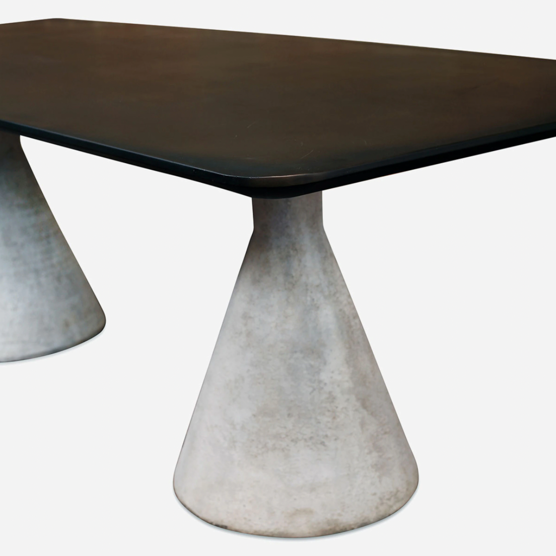 This Conical Dining Table is made from stainless steel and inspired by Willy Guhl Hourglass Planters. The unique base is made from aluminum with a concrete finish - a statement piece for any dining room or kitchen!   Size: 40"d x  94"w x 30" h Materials: Stainless Steel