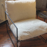 Similar to an Amethyst Favorite Alvar Chair, this Allison Occasional Chair - Faux Skin is textured and beautiful. The thin, matte black metal frame elevates the space for any bedroom, living room, or other space.  Faux Sheepskin Fabric with Black Metal Natural Faux Sheepskin Upholstery with Matte Black Metal 