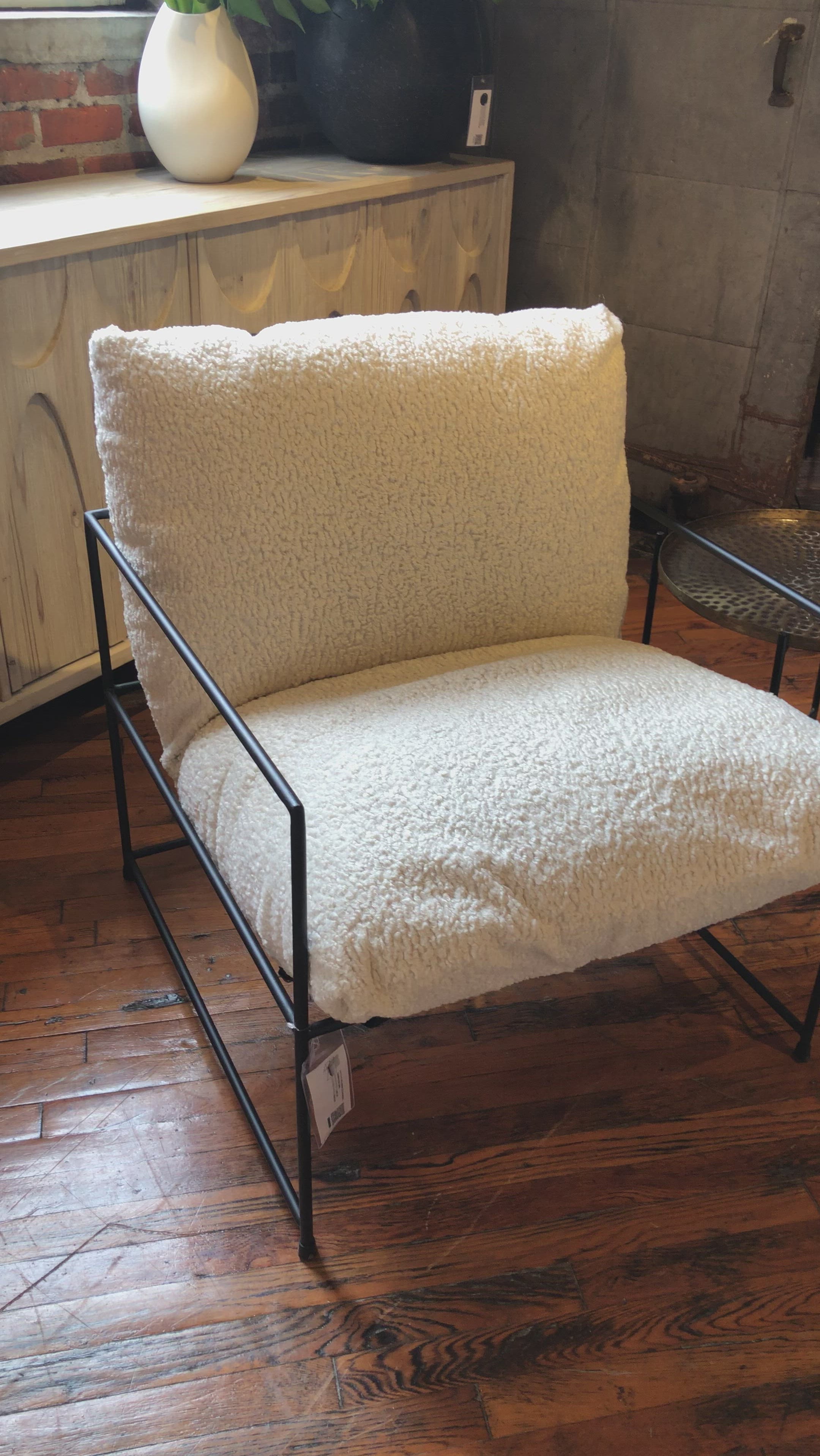 Similar to an Amethyst Favorite Alvar Chair, this Allison Occasional Chair - Faux Skin is textured and beautiful. The thin, matte black metal frame elevates the space for any bedroom, living room, or other space.  Faux Sheepskin Fabric with Black Metal Natural Faux Sheepskin Upholstery with Matte Black Metal 