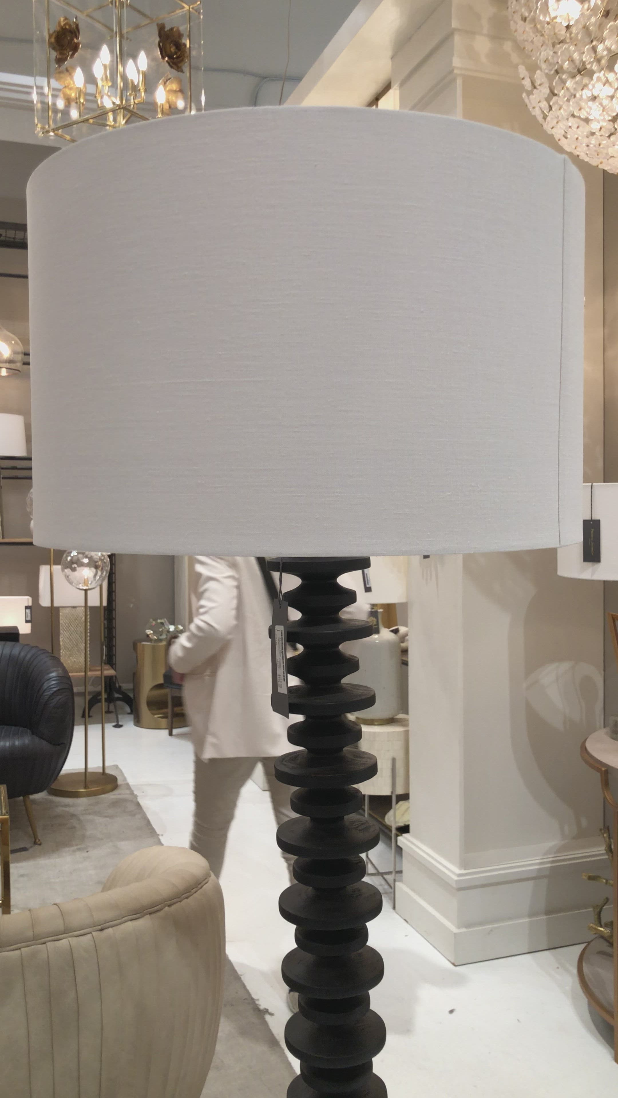 Textured bands ripple down the graduated column of our sculptural Fishbone floor lamp. Corrugated birch wood is handcrafted by artisans and balanced with a natural linen shade. This elegant profile makes a simple yet stunning statement to any living room, bedroom or den.  Size: 67"h x 21.5"w x 21.5"d
