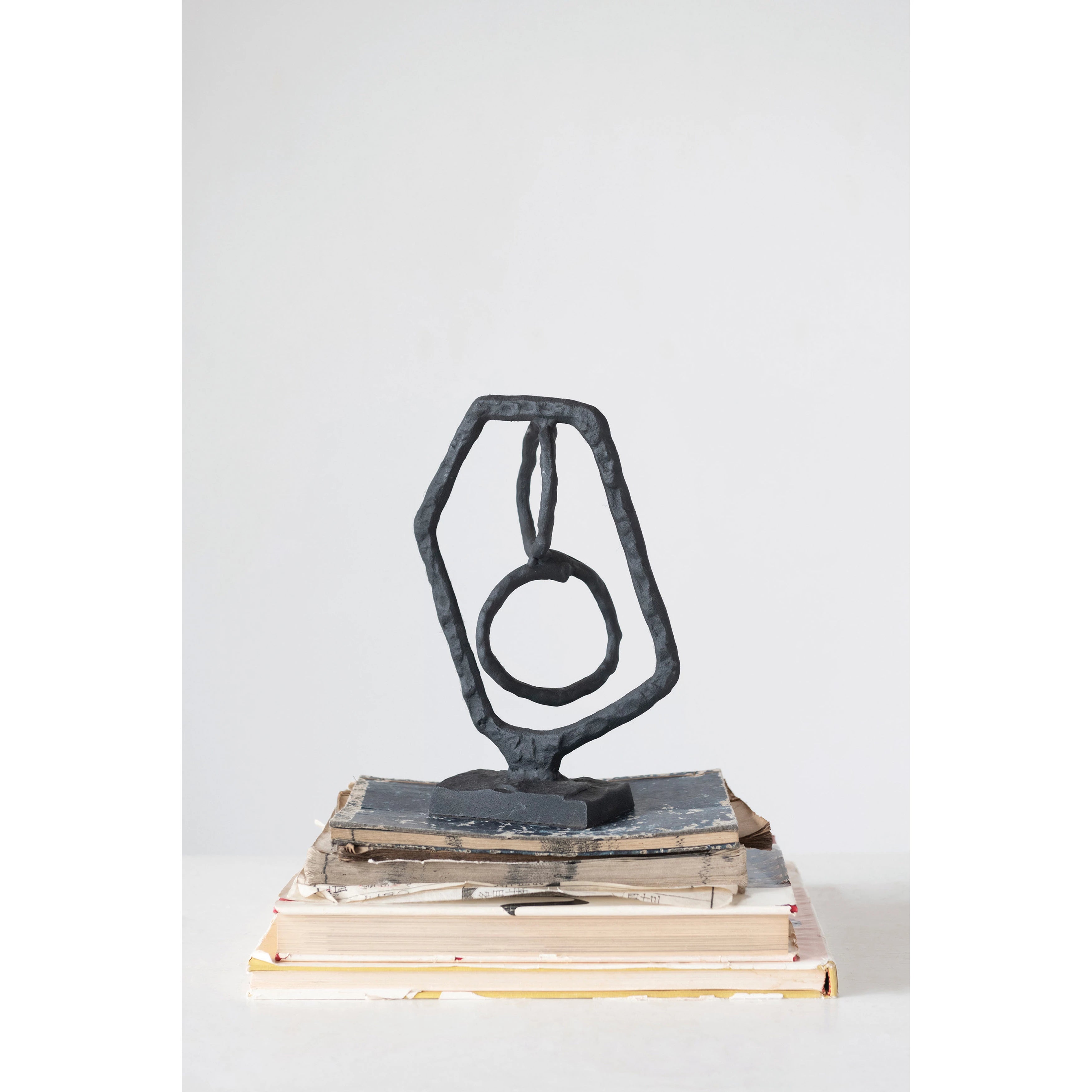This Cast Iron Abstract Sculpture adds so much interest to any shelf, nook, or decorative area.   Size: 7.75"L x 2.75"W x 11"H