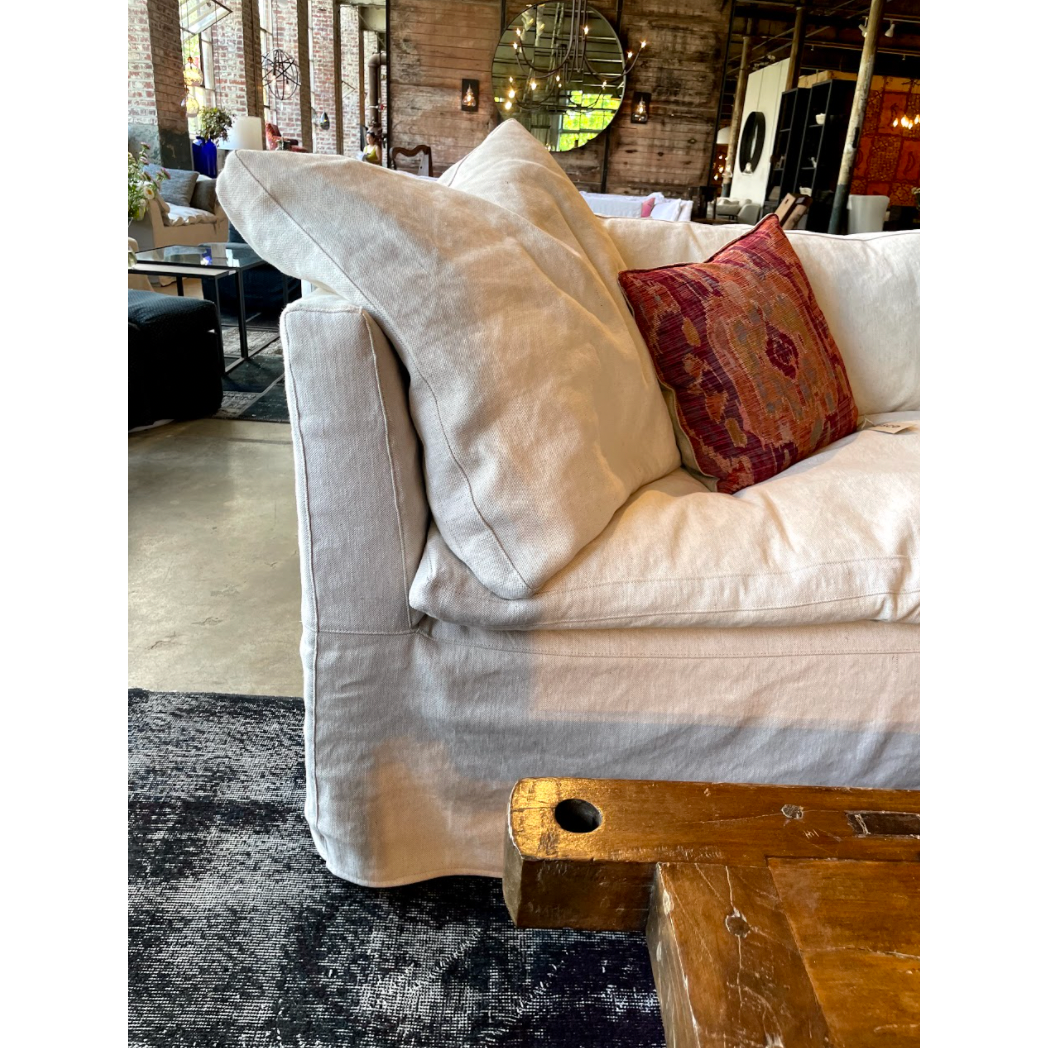 This cozy Havana Sofa from Cisco Brothers is a wonderful addition to any room. The sofa features a gorgeous rounded frame with a slight taper to the front. This was instant swoon when we saw this at market. As shown slipcovered in Mariet White 100% linen fabric.   108"w x 35"d x 30"h  Seat Space: 96"w x 22"d x 20"h