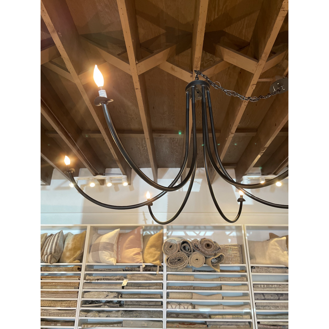 Add unique and modern lighting to a room with this Ramo Chandelier from Cisco Brothers. The curved arms add beautiful sight lines to the fixture and plenty of light.  Overall: 60”dia. 30.5"h Chain Length: 3' Canopy: 6"dia