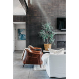 The Victor leather chair instantly transforms any living room into an infinitely sophisticated space. The tan leather upholstery and gently curved back are both chic and superbly comfortable. The chair is supported by a pocketed coil spring seating on solid oak wood legs for added durability.