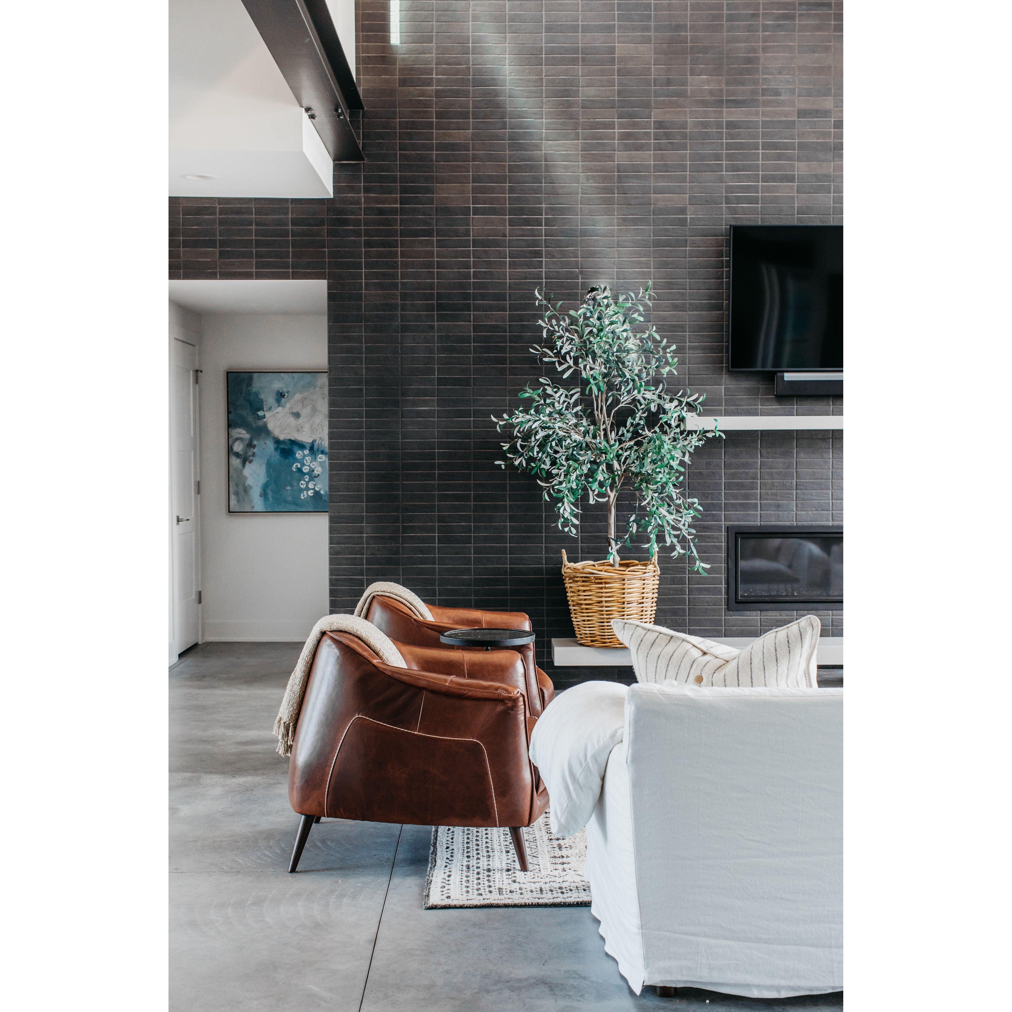 The Victor leather chair instantly transforms any living room into an infinitely sophisticated space. The tan leather upholstery and gently curved back are both chic and superbly comfortable. The chair is supported by a pocketed coil spring seating on solid oak wood legs for added durability.