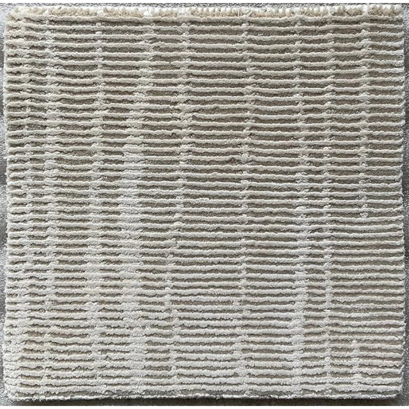 We love the textured look of this Custom Wool / Silk Rug - Rameen Bisque - Cream. Made from wool and silk, this is the perfect rug to feature in your living room, entryway, or other high traffic area.   $80 per square foot. For example, an 8'x10' rug is $6400.  Fine hand made Nepalese Tibetan rug  Quality: 100 knots Material: Wool, 60% Silk Pile: 0.2"-0.16"