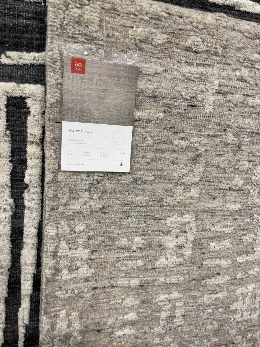 The Naomi Fog Area Rug is hand-knotted of wool and cotton by artisans in India. Naomi offers bold designs with earthy hues and features a high-low pile that adds depth and dimension, making each piece create the illusion of movement. A perfect rug for your living room, entryway, or other  Hand Knotted 89% Wool | 11% Cotton NAO-01 Fog 